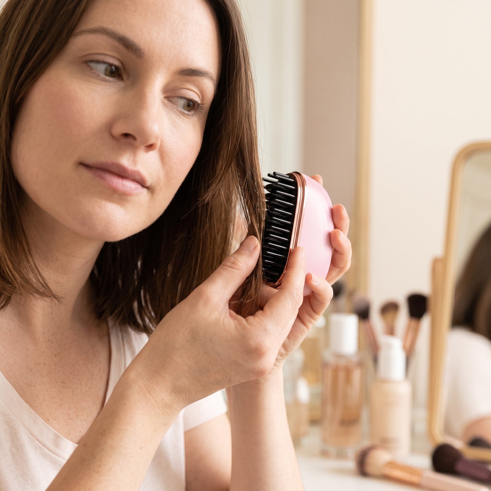 Woman smoothing a dry section with Pink brush