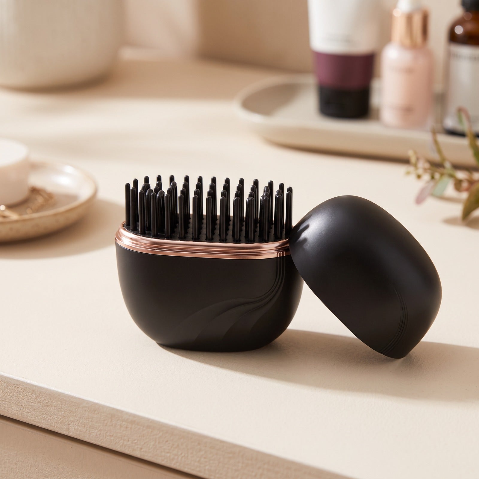 Black brush on a tabletop with removable cap