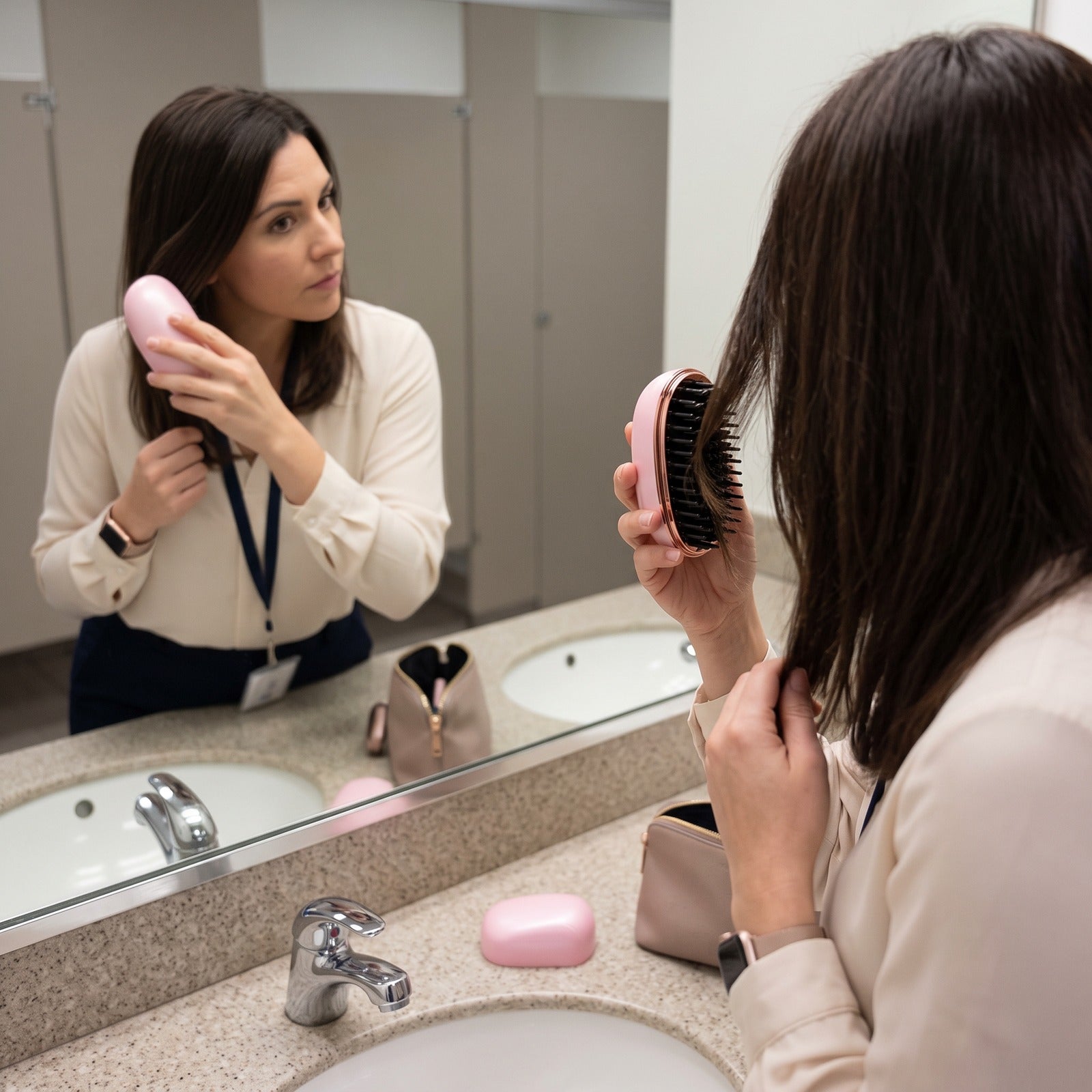 Pink brush touch-up in a work washroom