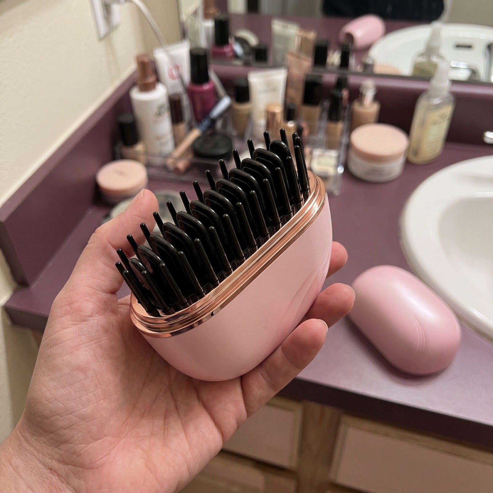 Pink brush casing and teeth close-up