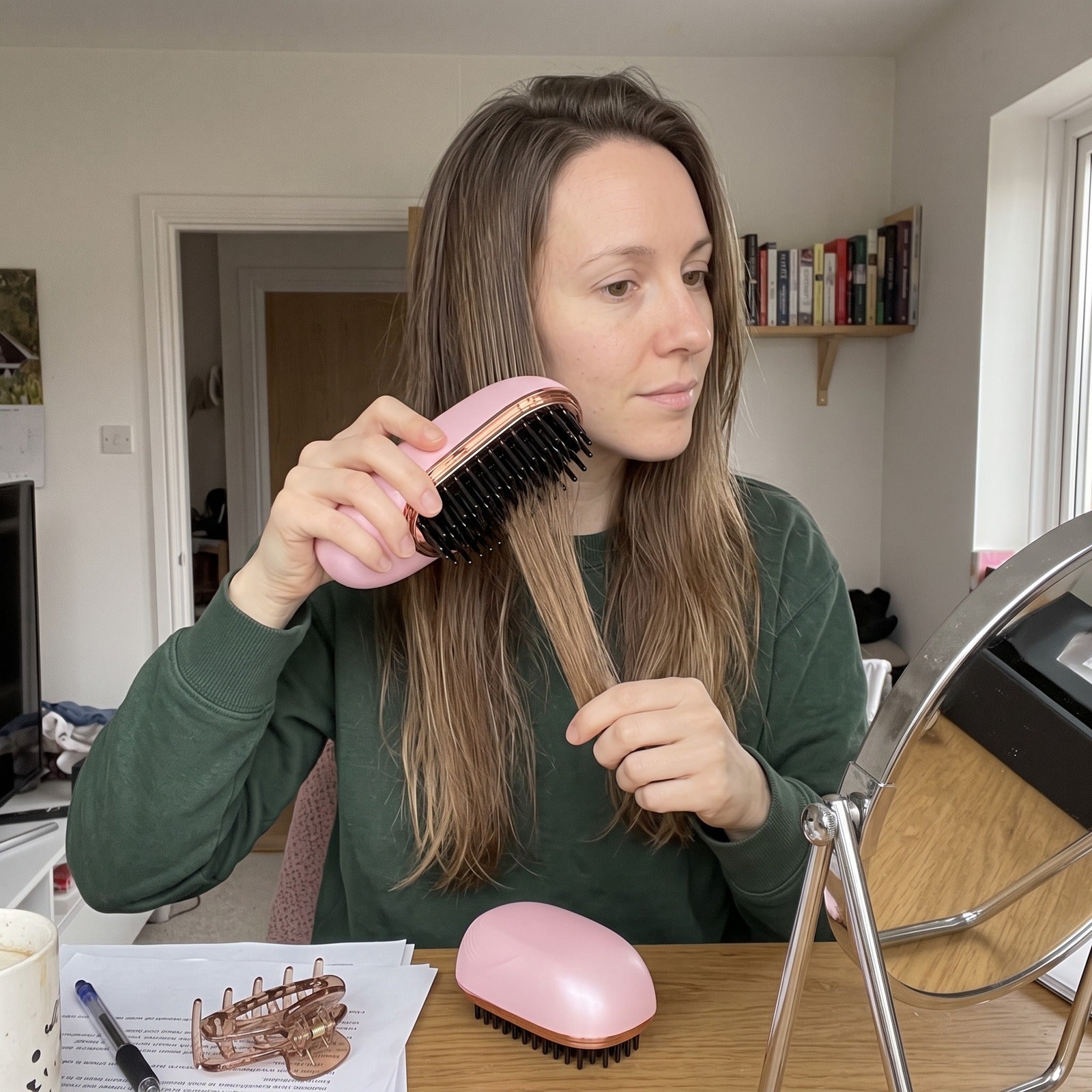 Owner styling dry hair in a mirror