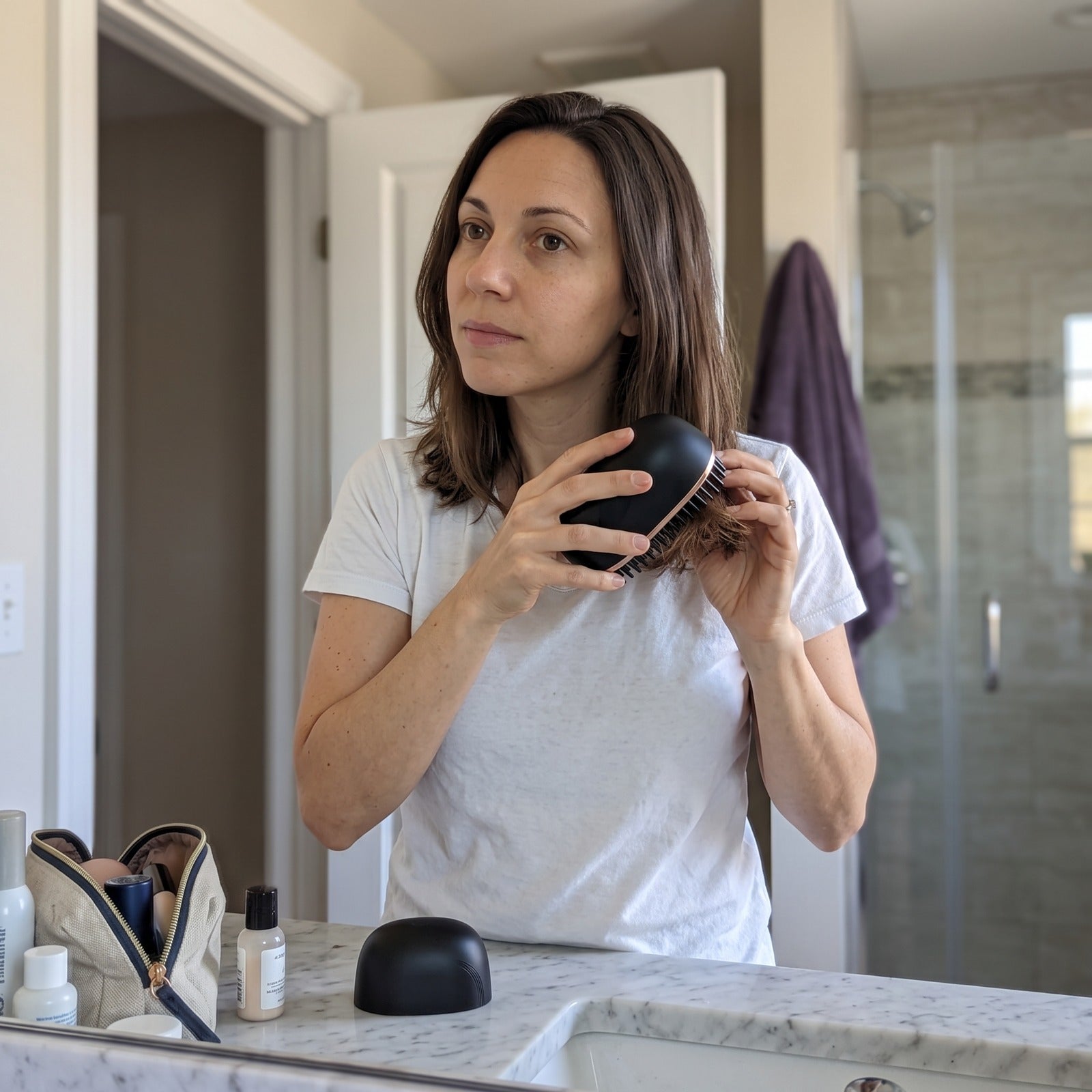 Woman getting ready at a vanity mirror